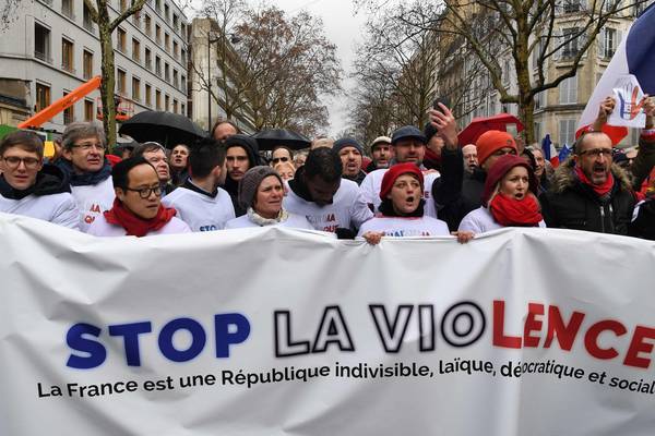 ‘Red scarves’ march in Paris to condemn ‘yellow vest’ violence