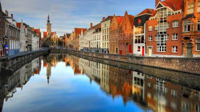 Visit Bruges for chocolate-dominated desserts and lively boat trips