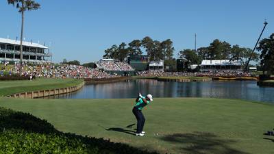 Day survives brutal Sawgrass conditions to lead by four