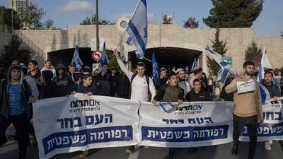 Netanyahu delays bid to overhaul Israel’s judiciary as protests rage