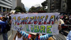Thousands protest in Caracas for and against Nicolás Maduro