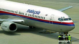 Malaysian plane still missing amid false passport claims
