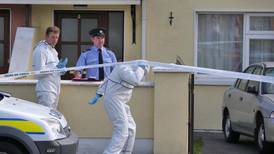 Two held  as body of man found in Carlow house