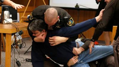 Father of victims lunges at paedophile Larry Nassar in court