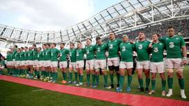 Irish rugby players standing shoulder to shoulder with healthcare workers