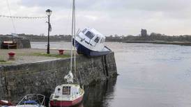 In pictures: Storm Debi leaves behind flooded businesses, fallen trees and marooned boats