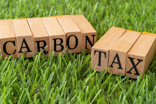 Global carbon tax could cut emissions 12% and limit economic cost - new report