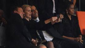 Obama, Cameron pose for ‘selfie’ at service