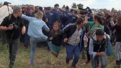 Camerawoman who tripped migrants in Hungary to face trial