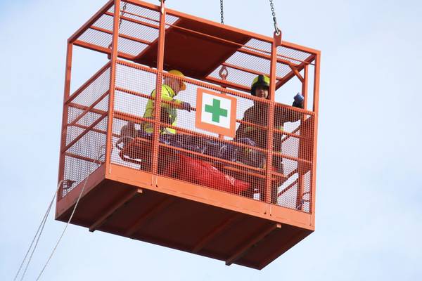 Construction worker rescued using crane after suffering injury