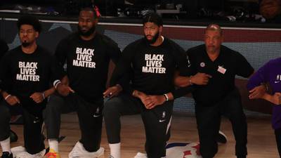 Players, coaches and referees protest racial injustice as NBA returns