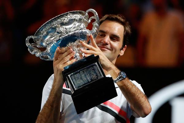 Federer stays cool in stifling heat as he claims Australian Open