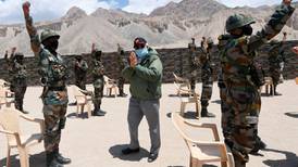 China pulls back troops locked in standoff with Indian army since May