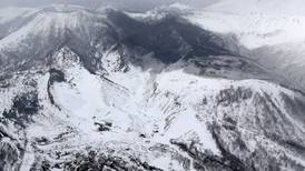 Avalanche engulfs skiers after volcano erupts in Japan