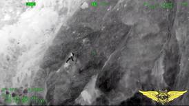 California authorities come to rescue of man left clinging to side of cliff
