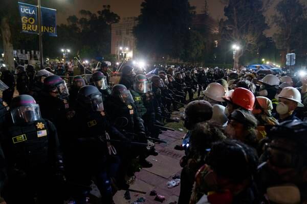 Hundreds of US police swarm UCLA pro-Palestinian camp firing flash bangs and arresting protestors