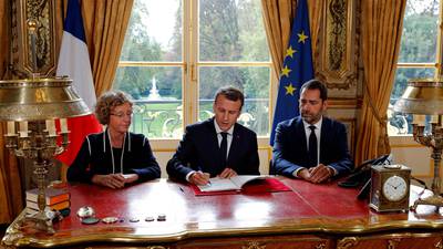 Macron signs labour law but has to lower senate ambitions