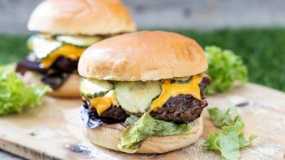 Beef burger with dill sauce, pickles and cheese