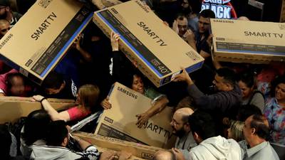 US online sales surge as shoppers throng stores for Black Friday