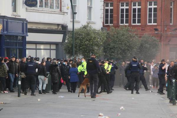 Three gardaí injured and 23 arrested after clashes at Dublin anti-lockdown protest