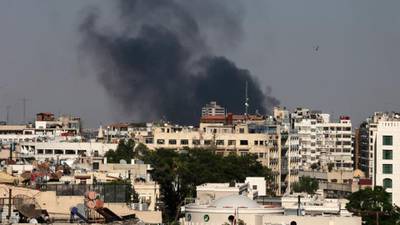 Divided Damascus apprehensive, hopeful over western strike