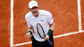 Andy Murray eases past John Isner after rain interruption to reach last eight