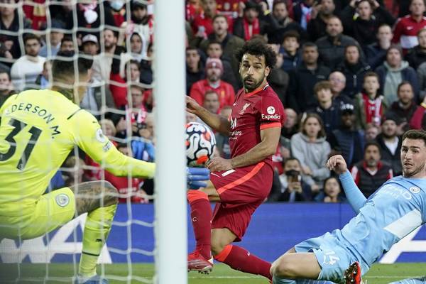 Liverpool and Man City share points after frantic second half