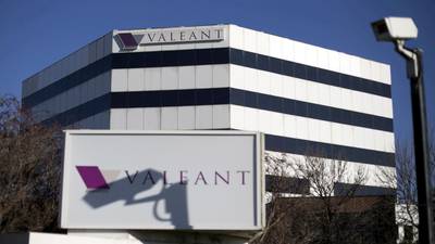 Debt-laden Valeant Pharmaceuticals cuts full-year forecast