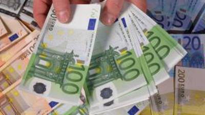 Greece casts shadow as ECB money printing buoys euro zone