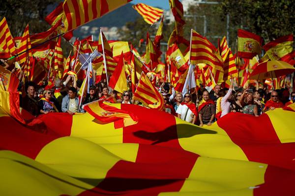Pro-union Catalans mix festivity with calls for Puigdemont’s jailing