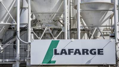 CRH notes  that Lafarge is willing to revise terms of planned merger with Holcim