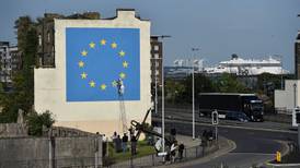 Brexit mural by Banksy in Dover shows man chipping away at EU flag