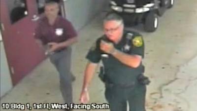 Deputy charged after staying outside during Parkland shooting