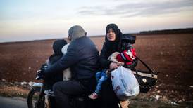 On Turkish side of border, Syrian refugees wait and worry