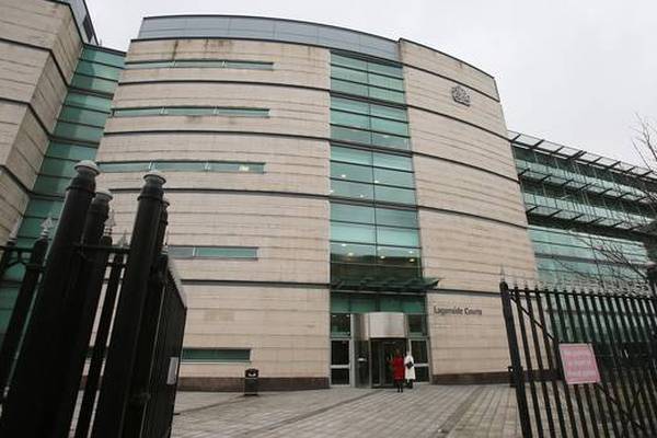 Man charged with naming woman in Belfast rape trial