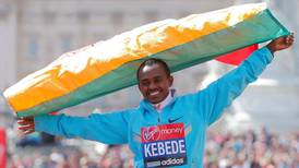 Tsegaye Kebede regains London marathon title with storming finish to race that started in sombre mood