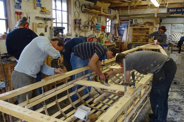 Asylum seekers launch currach built with traditional boat builders, Meitheal Mara