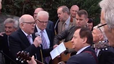 Video of singalong at Big Tom’s graveside goes viral