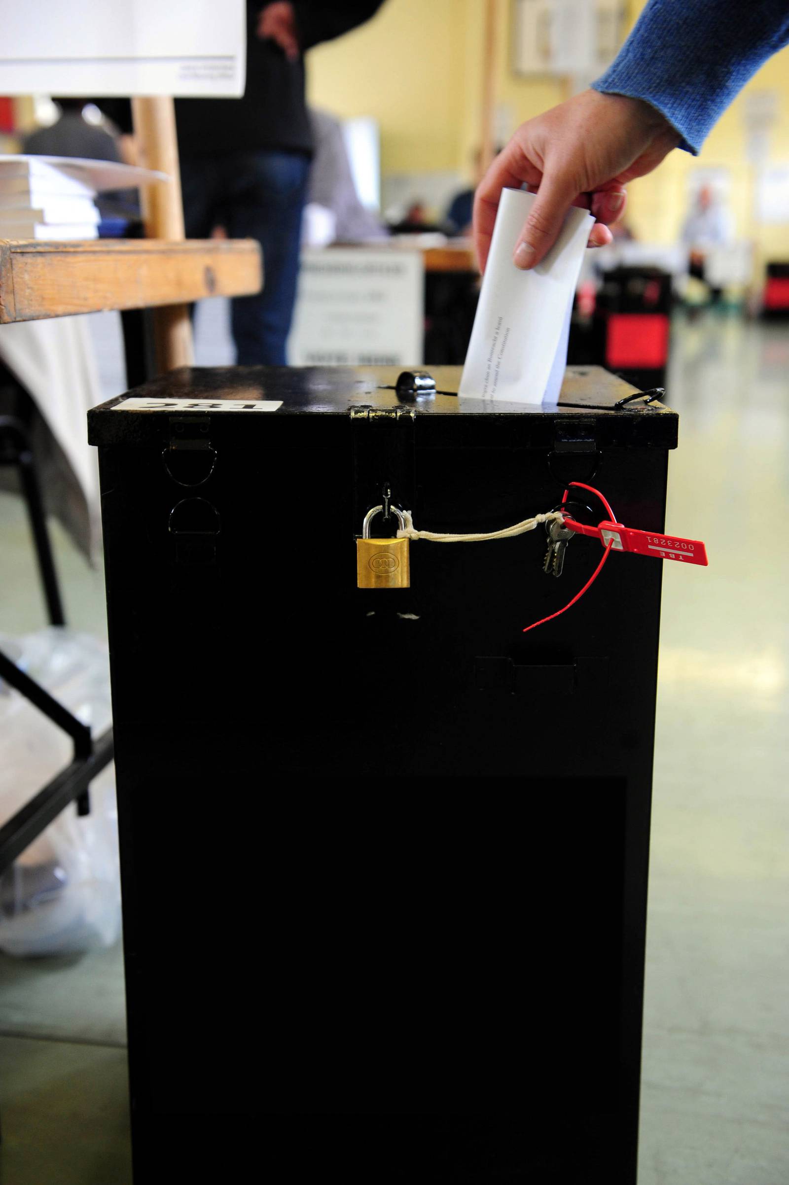 A woman drops her vote into the ballot box during the vote on the European Union's fiscal treaty referendum at a Polling Station in Dublin, Ireland, on Thursday, May 31, 2012. The Irish vote on the European Union's latest treaty today, with polls indicating they will endorse measures designed to ease the euro region's debt crisis. Photographer: Aidan Crawley/Bloomberg