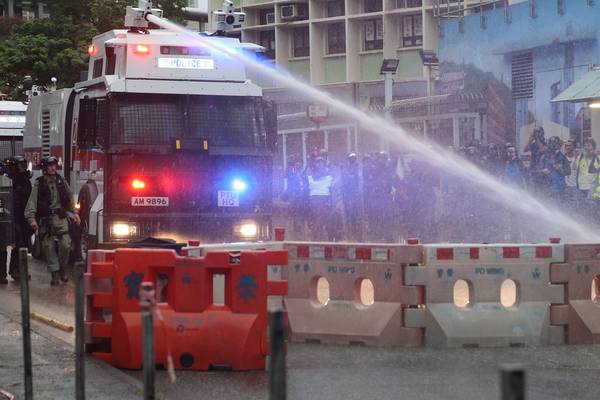 Hong Kong protests: police fire teargas and water cannon and arrest 29