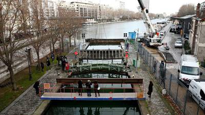 Clean-up gets under way at canal St Martin in Paris