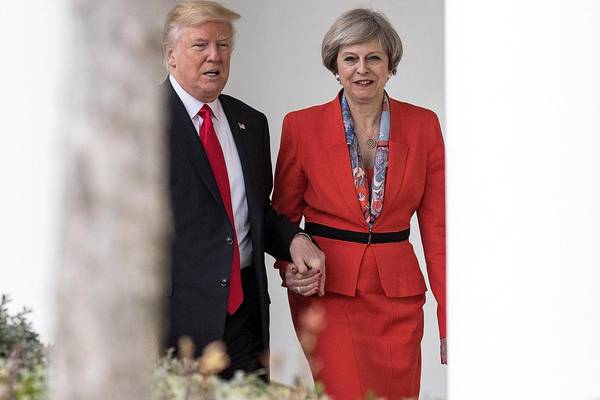 May criticises Trump for retweets of ‘hateful’ far-right group