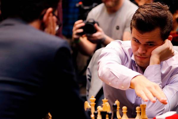 Magnus Carlsen retains his world chess crown