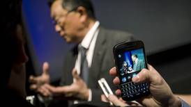 BlackBerry reduces  losses, but handsets still struggle