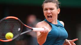 Simona Halep recovers from slow start to make second round
