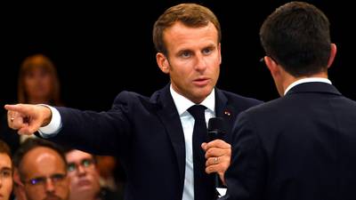 Macron takes tougher immigration stance in bid to compete with far right