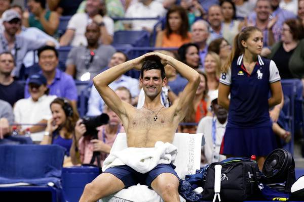 Djokovic conquers conditions to reach US Open semis