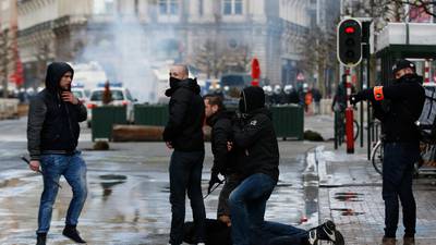 Riot police in Brussels use water cannons on demonstrators