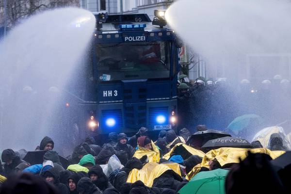 German police use water cannon to clear protestors at far-right party convention