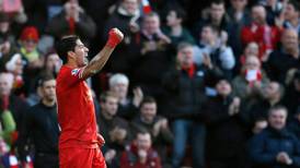 Suarez stars again as Liverpool go top